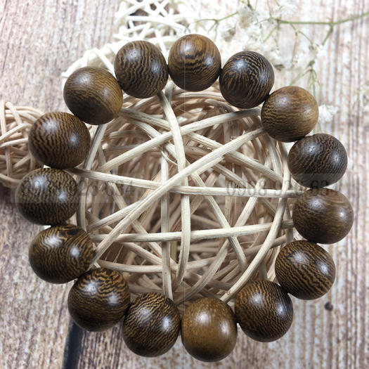 Vòng đeo tay hạt gỗ mun vân lông công - Chuỗi đeo tay gỗ mun 12 ly - Vòng phong thủy mang lại bình an và may mắn