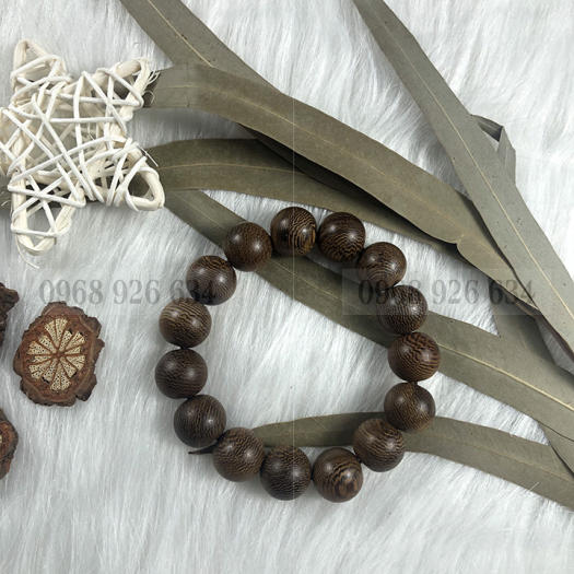 Vòng đeo tay hạt gỗ mun vân lông công - Chuỗi đeo tay gỗ mun 12 ly - Vòng phong thủy mang lại bình an và may mắn