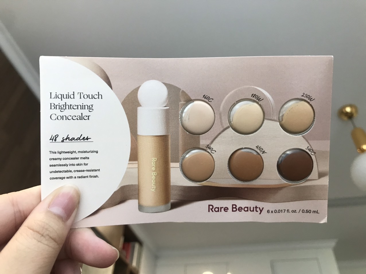 Kem che khuyết điểm Rare Beauty Liquid Touch Brightening Concealer - 0.50ml
