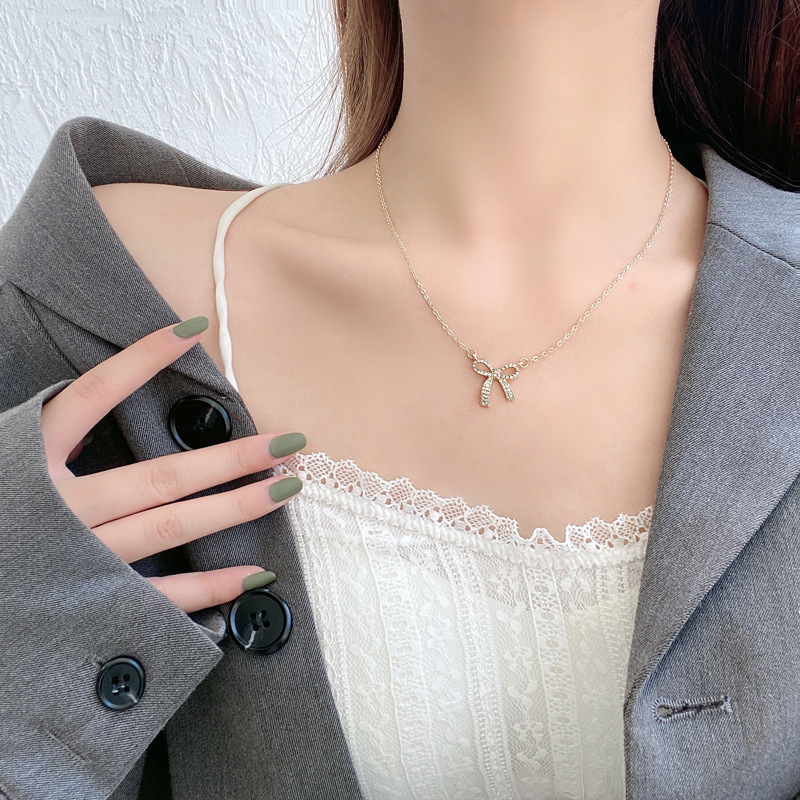 Dây chuyền nữ, Vòng cổ nữ màu vàng họa tiết nơ đính đá sang trọng, phong cách