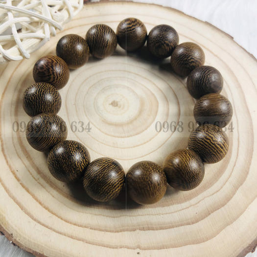 Vòng đeo tay hạt gỗ mun vân lông công - Chuỗi đeo tay gỗ mun 12 ly - Vòng phong thủy mang lại bình an và may mắn