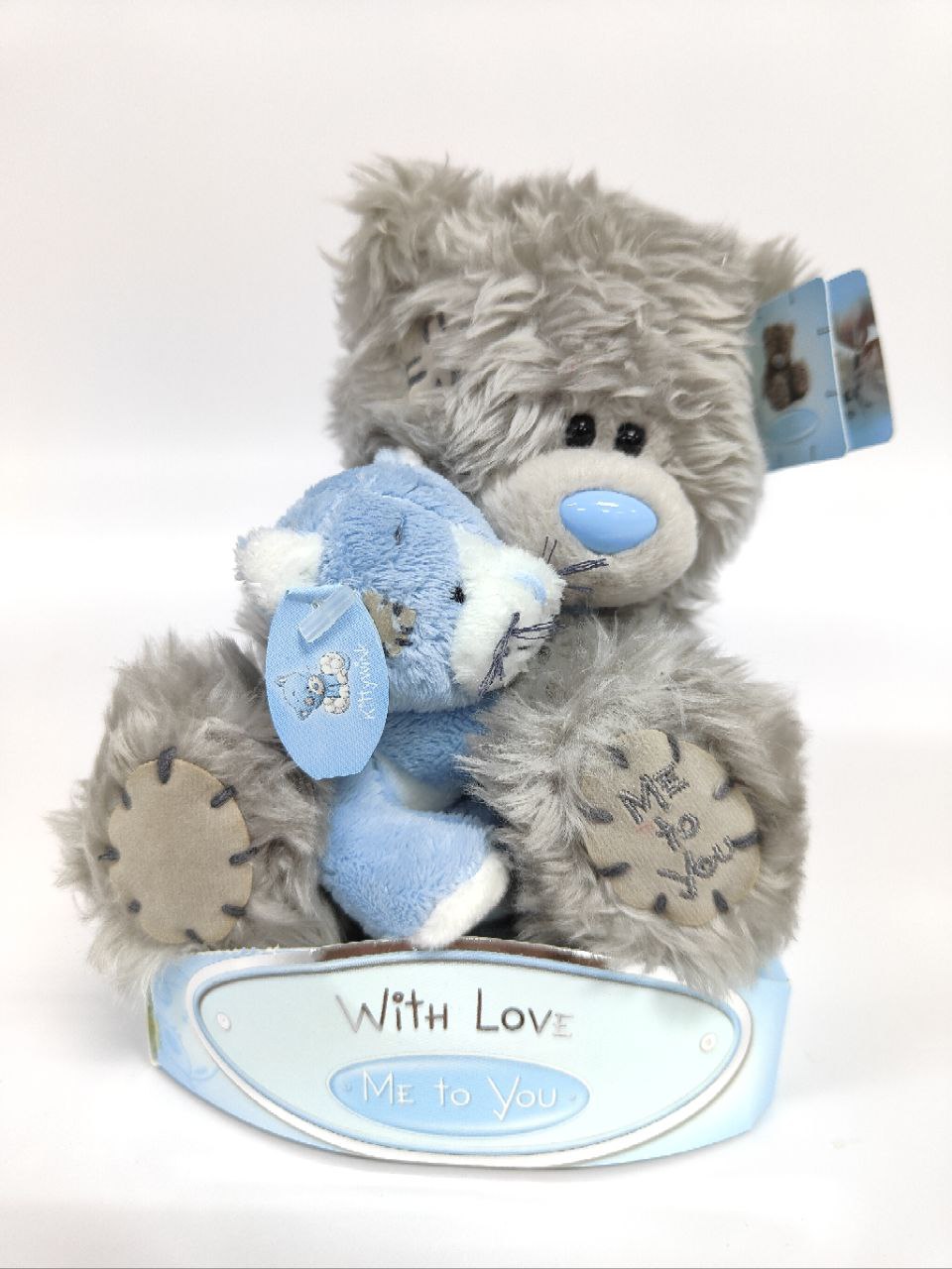 large tatty teddy bear