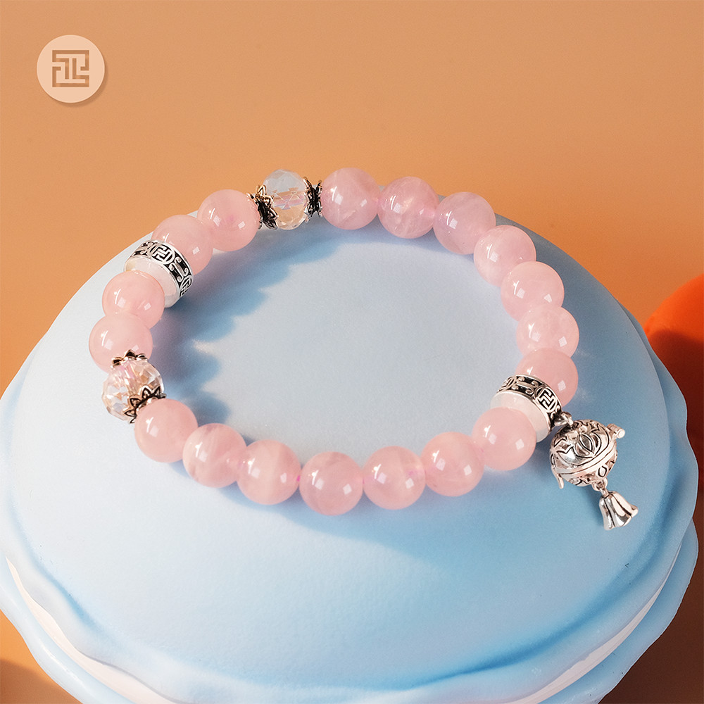 Tinh lâm vòng tay phong thủy đá thạch anh hồng 8,5 li - charm hoa sen