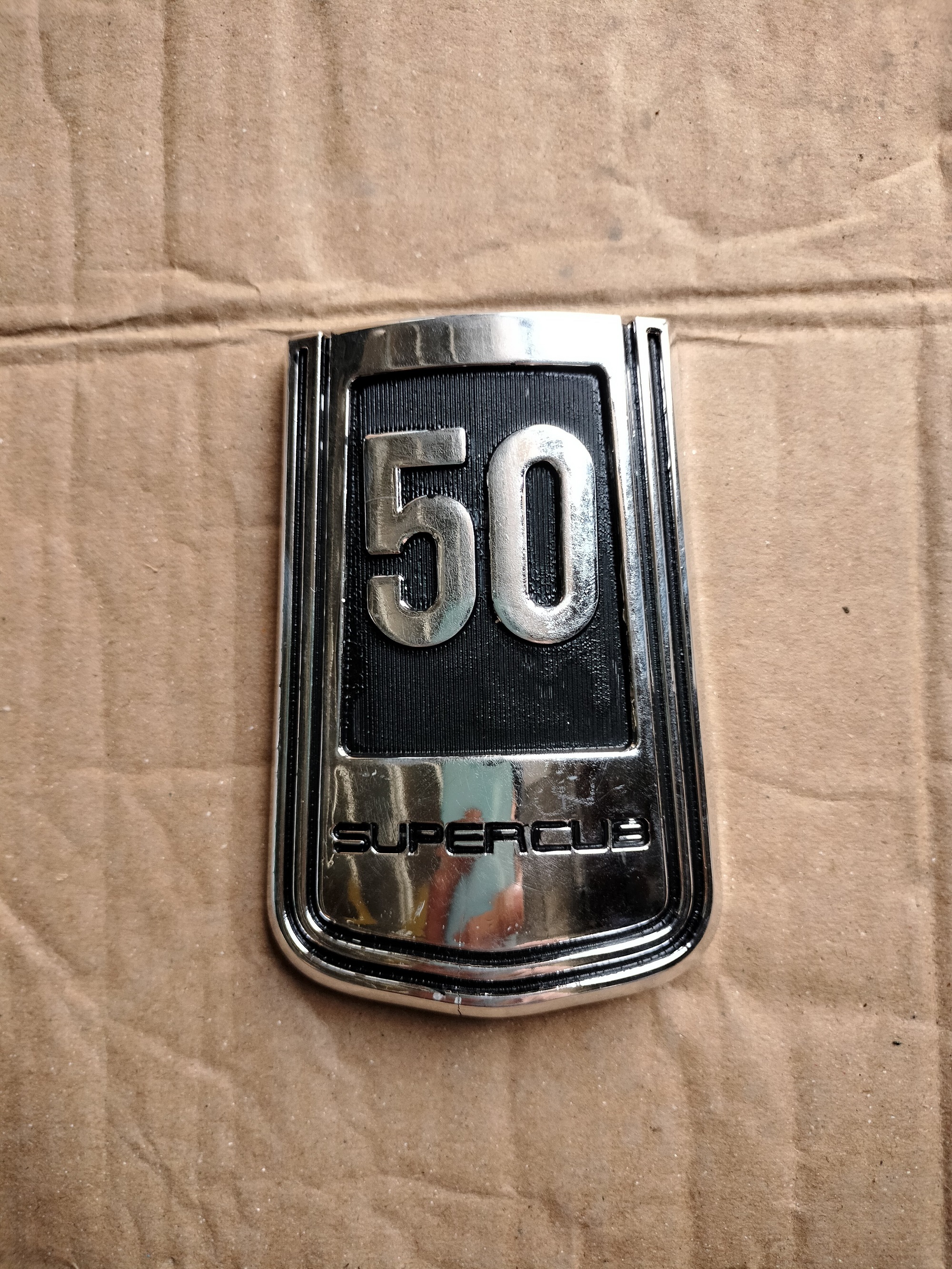 Logo mặt lạ super cub 50