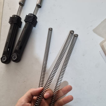 Lò xo chống giật nhẩy máy giặt