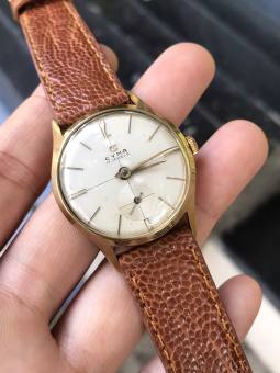 Đồng hồ nữ Cyma Thụy Sĩ 17 Jewels cơ lên cót tay chạy kim rốn kim số vàng niềng vàng dây da