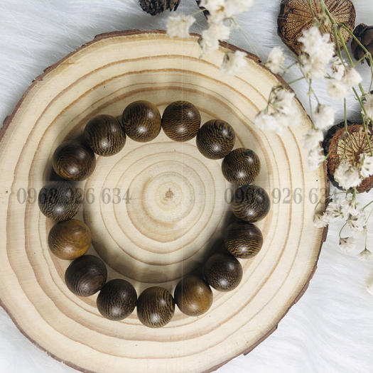 Vòng đeo tay hạt gỗ mun vân lông công - Chuỗi đeo tay gỗ mun 12 ly - Vòng phong thủy mang lại bình an và may mắn