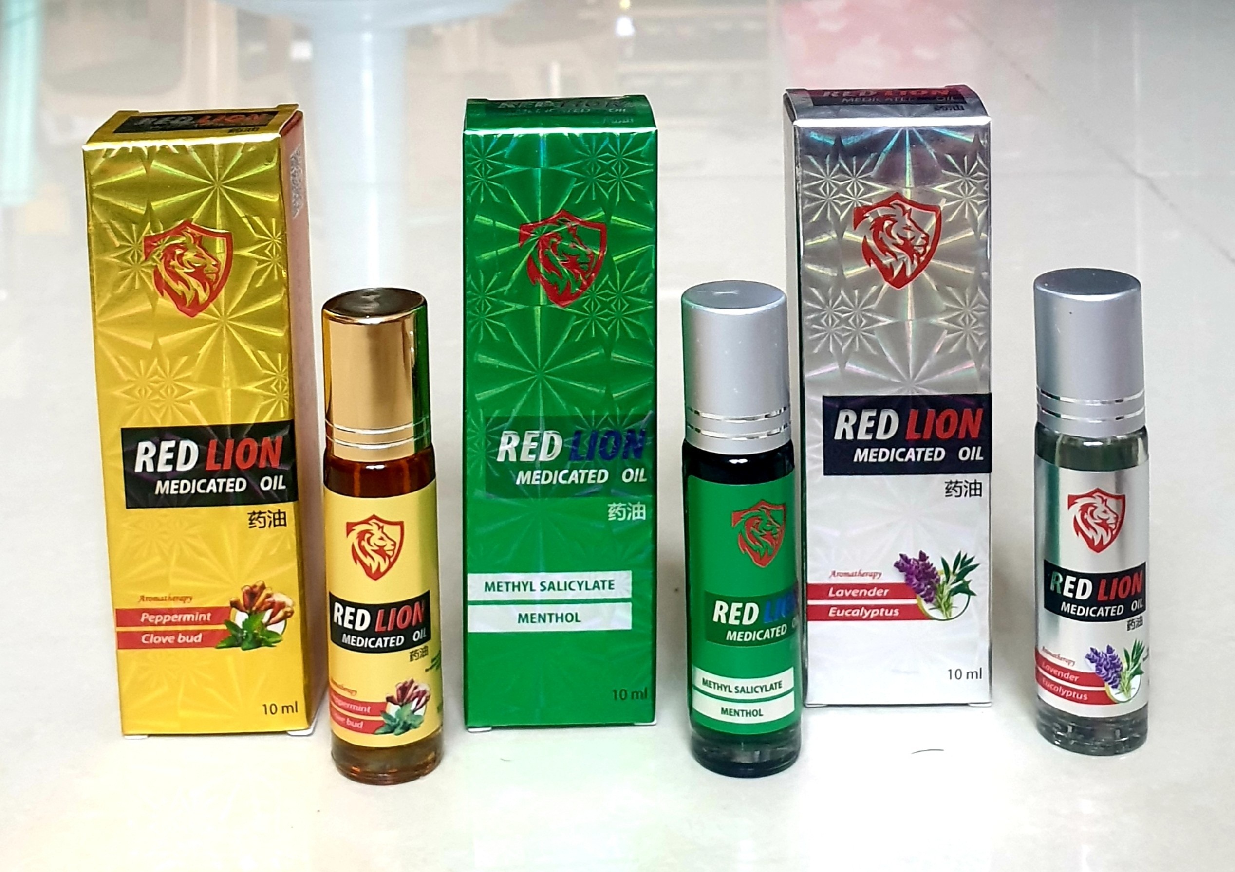 Dầu gió xoa bóp, cạo gió trắng - xanh - vàng dạng lăn RED LION (SP của công ty dược Agimexpharm)